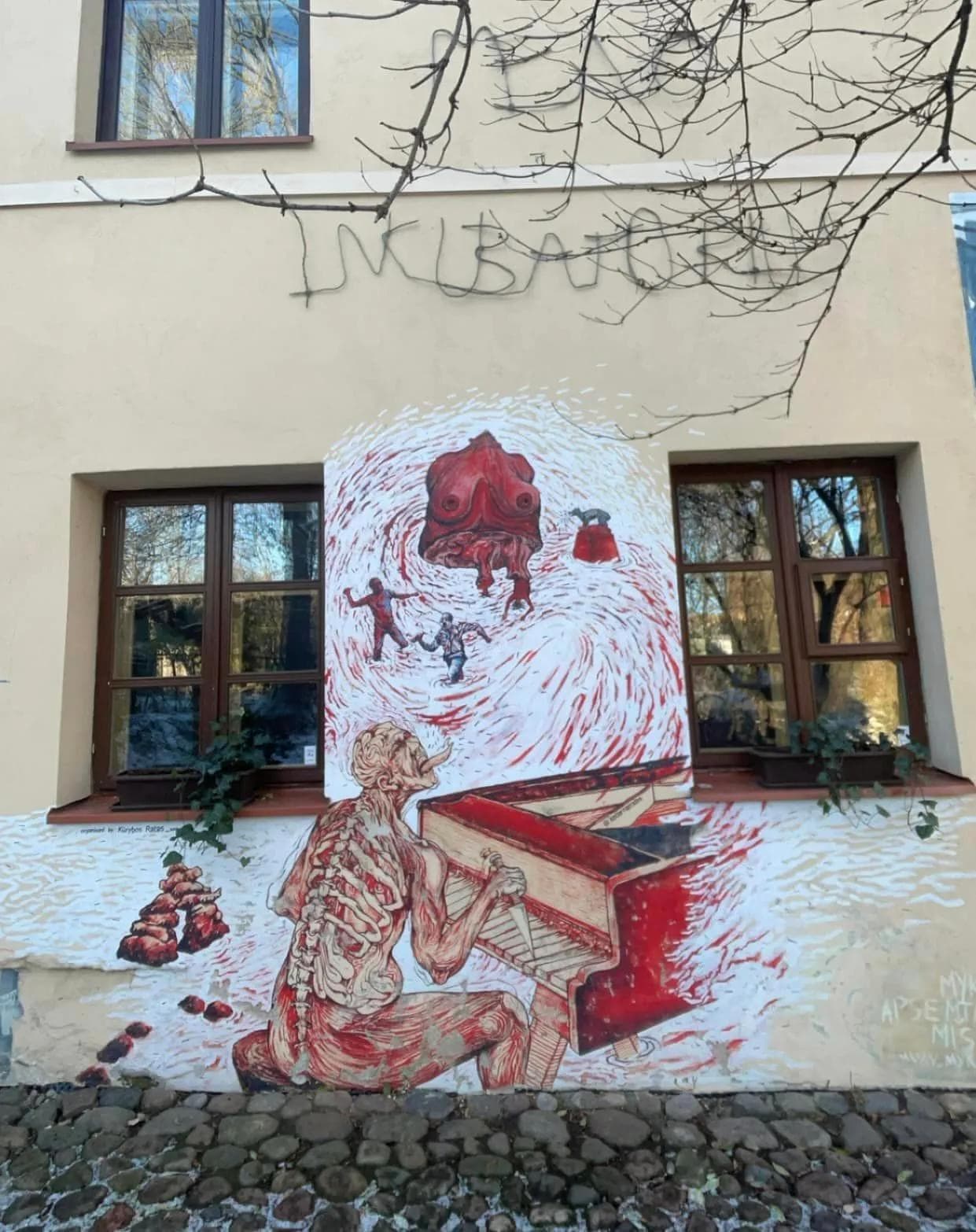 A clean, minimalist workspace with a single laptop showing a code editor and a green 'success' terminal.